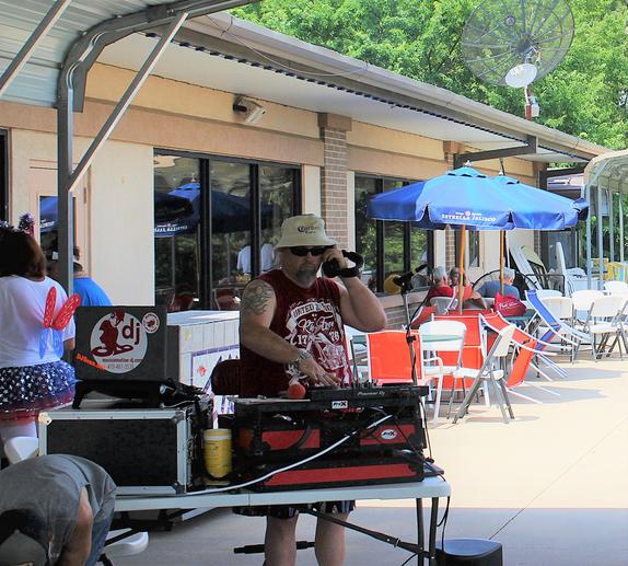 DJSean Hearn spinning the summertime, fun in the sun, tunes at the pool at the Elks Lodge in Fayetteville Arkansas.